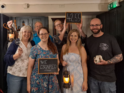 Escape Room A sucessful team celebrate at the end of an Escape Room
