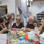 Discussing the clues at A Taste Of Murder - photo by Juliamaud