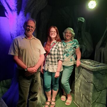 two women and a man in an escape room